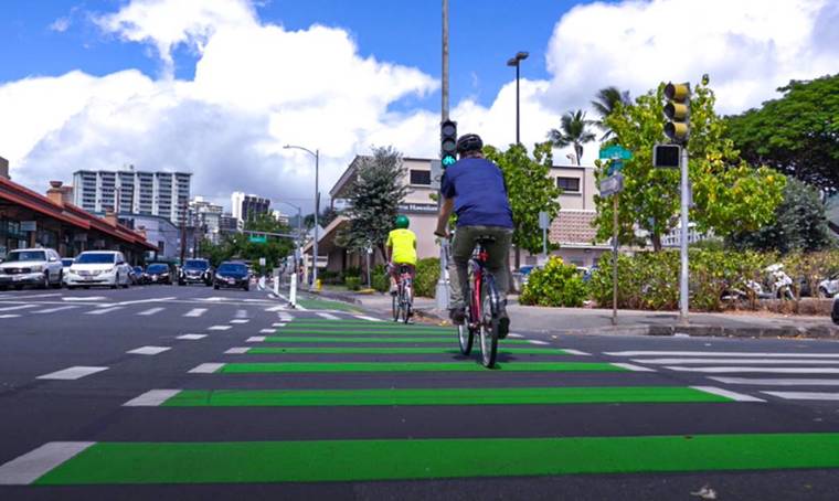 COURTESY CITY AND COUNTY OF HONOLULU
                                Bicyclists traverse the protected Pensacola bike lane, which opened today.