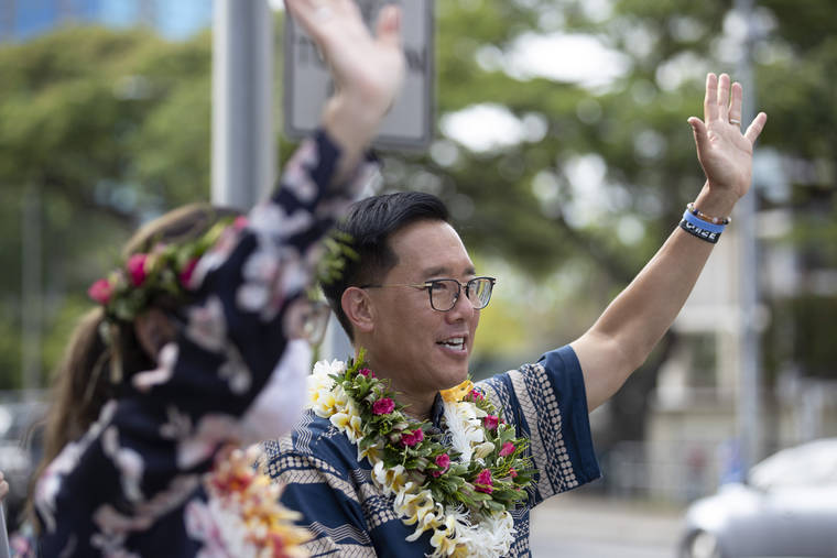 CINDY ELLEN RUSSELL / CRUSSELL@STARADVERTISER.COM
                                Mayoral candidate Keith Amemiya and his wife Bonny waved to drivers near the State Capitol on July 14.