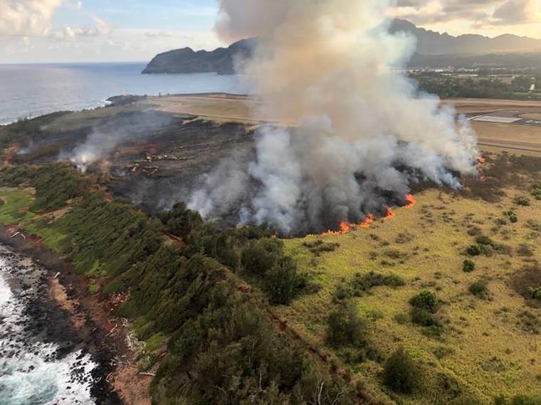 COURTESY KAUAI FIRE DEPARTMENT
                                Kauai firefighters extinguished a brushfire near Lihue Airport on Monday. The blaze was contained at approximately 7:45 p.m.