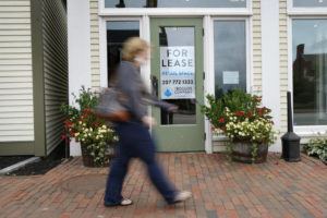 ASSOCIATED PRESS
                                A shopper walks by one of several vacant retail spaces among the outlet shops in Freeport, Maine, in September.