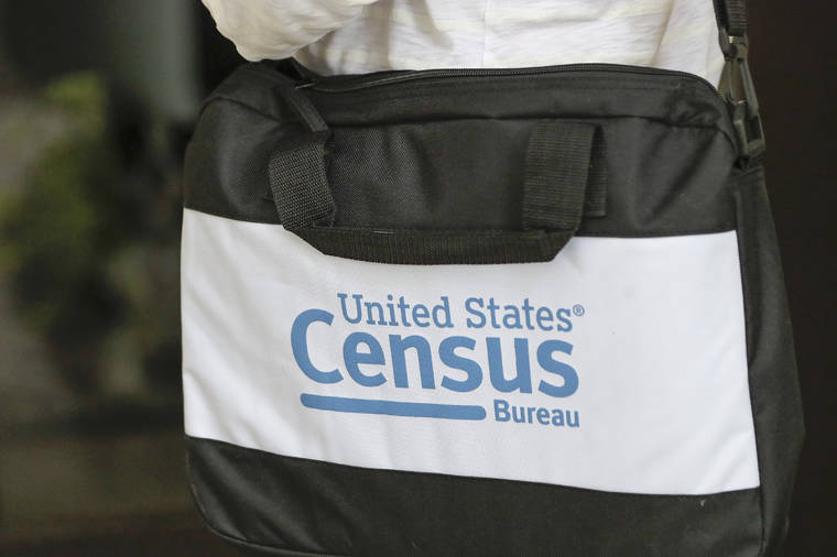 ASSOCIATED PRESS
                                A briefcase of a census taker was seen as she knocked on the door of a residence, Aug. 11, in Winter Park, Fla. The U.S. Supreme Court today stopped the once-a-decade head count of every U.S. resident from continuing through the end of October.