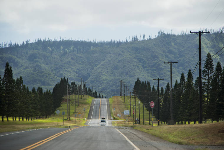STAR-ADVERTISER / 2017
                                A car is seen on a stretch of road from the Lanai Airport to Lanai City.