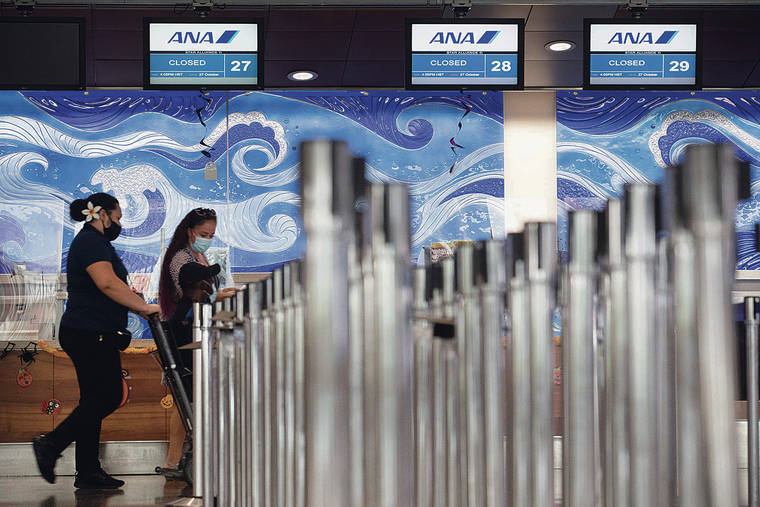 GEORGE F. LEE/GLEE@STARADVERTISER.COM
                                Travelers and passersby walked past the closed All Nippon Airways ticket counter Tuesday at Daniel K. Inouye International Airport. ANA, Japan Airlines and Hawaiian Airlines have announced service to Hawaii will return in November.