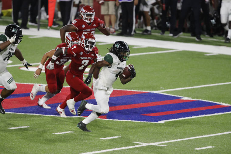 DAVID MCINTYRE / SPECIAL TO THE STAR-ADVERTISER
                                Hawaii Warriors running back Miles Reed runs the ball against the Fresno State Bulldogs during the fourth quarter.
