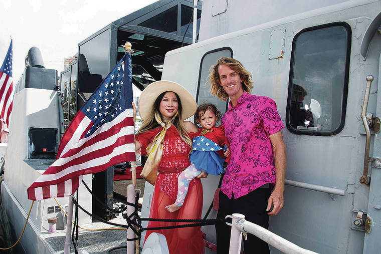 CRAIG T. KOJIMA / CKOJIMA@STARADVERTISER.COM
                                Trump supporters Alice and Justin Aoki, with daughter Amika, got ready to sail out from Kewalo Basin to go campaigning off Waikiki aboard their converted boat.