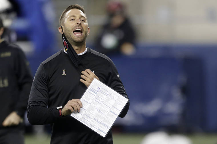 ASSOCIATED PRESS
                                Arizona Cardinals head coach Kliff Kingsbury removes his mask to yell before an NFL football game against the Seattle Seahawks, Thursday, in Seattle.