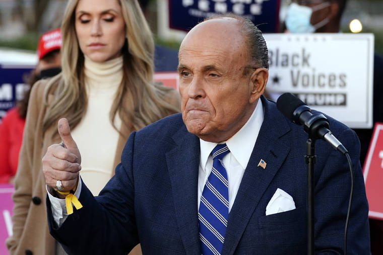 ASSOCIATED PRESS
                                Rudy Giuliani, a lawyer for President Donald Trump, speaks during a news conference on legal challenges to vote counting in Pennsylvania on Nov. 4 in Philadelphia. At left is Lara Trump, daughter-in-law of President Trump.