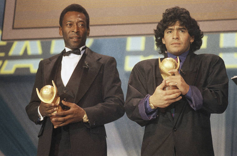 ASSOCIATED PRESS / MARCH 1987
                                Soccer greats Pele, left, and Diego Maradona hold “Sports Oscar” trophies in Milan, Rome, in 1987. Maradona died in his Argentine home today. Pele, with whom Maradona was regularly paired as the best of all time, said in a statement he had lost “a dear friend. … One day, I hope, we will play soccer together in the sky.”
