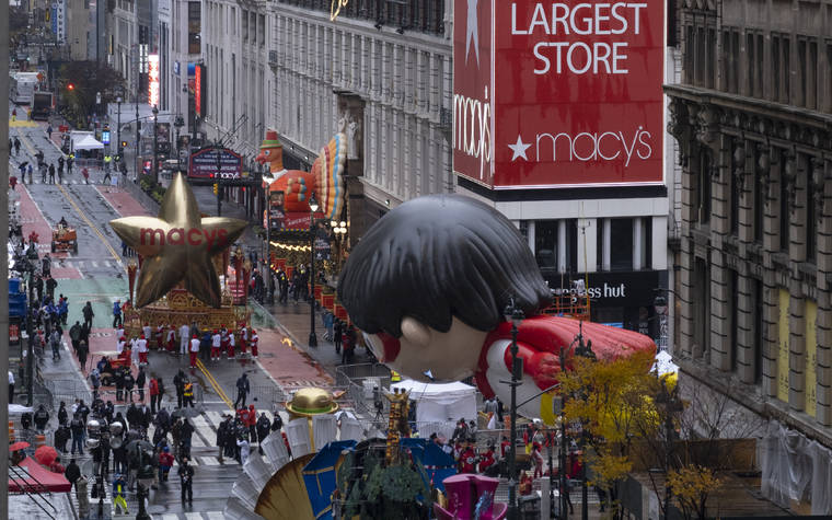 ASSOCIATED PRESS
                                Floats that are part of the modified Macy’s Thanksgiving Day Parade are seen from the Empire State Building in New York.
