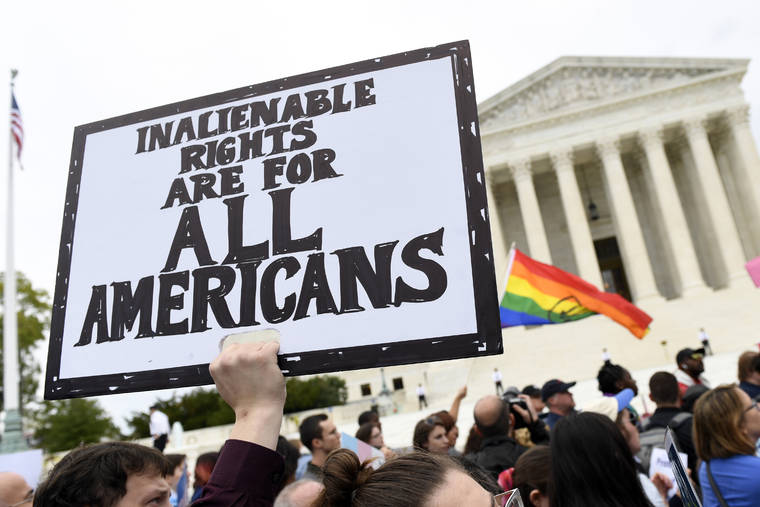 ASSOCIATED PRESS / 2019
                                Protesters gather outside the Supreme Court in Washington where the Supreme Court is hearing arguments in the first case of LGBT rights since the retirement of Supreme Court Justice Anthony Kennedy. As vice president in 2012, Joe Biden endeared himself to many LGBTQ Americans by endorsing same-sex marriage even before his boss, President Barack Obama. Now, as president-elect, Biden is making sweeping promises to LGBTQ activists, proposing to carry out virtually every major proposal on their wish lists.