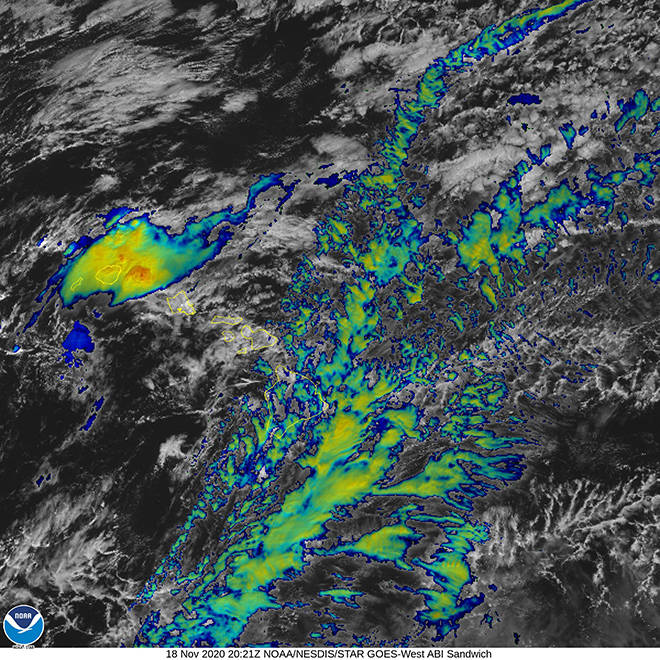 COURTESY NOAA
                                This color-enhanced satellite image shows heavy rain over Kauai this morning.