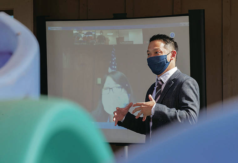 CINDY ELLEN RUSSELL / CRUSSELL@STARADVERTISER.COM
                                Deputy Prosecutor Mark Tom spoke to a group attending Community Outreach Court in Maili on Friday. The virtual hearings were held at the Villages of Maili.