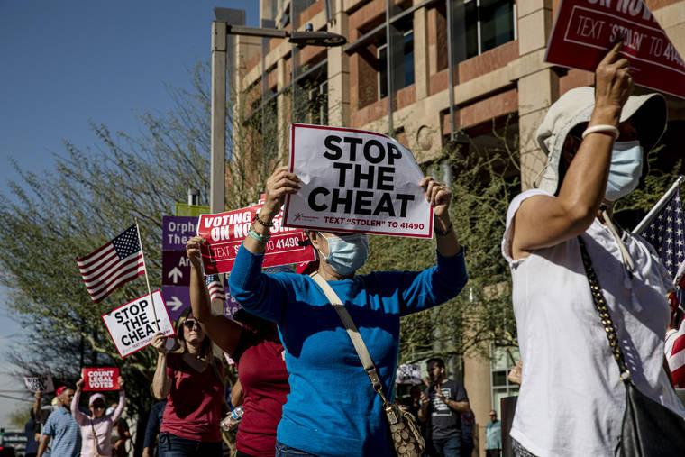 ADRIANA ZEHBRAUSKAS/THE NEW YORK TIMES
                                Supporters of President Donald Trump protest outside City Hall In Phoenix on Thursday. Attention shifted on Thursday to a handful of states where the presidential result remained too close to call.