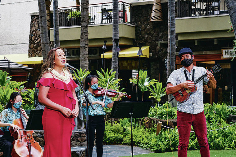 COURTESY HAWAII YOUTH SYMPHONY VIA VIBE CREATIVE MARKETING
                                Hawaii Youth Symphony musicians Celina Lim and Cameron Enomoto, from left in back, join vocalist Raiatea Helm and ukulele virtuoso Jake Shimabukuro at the Royal Hawaiian Center in preparation for the “Na Mele” fundraiser for the Youth Symphony.