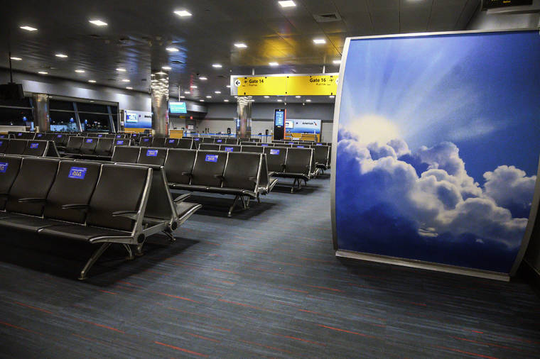 NEW YORK TIMES
                                The empty seating area near a boarding gate at John F. Kennedy International Airport in New York on Wednesday.