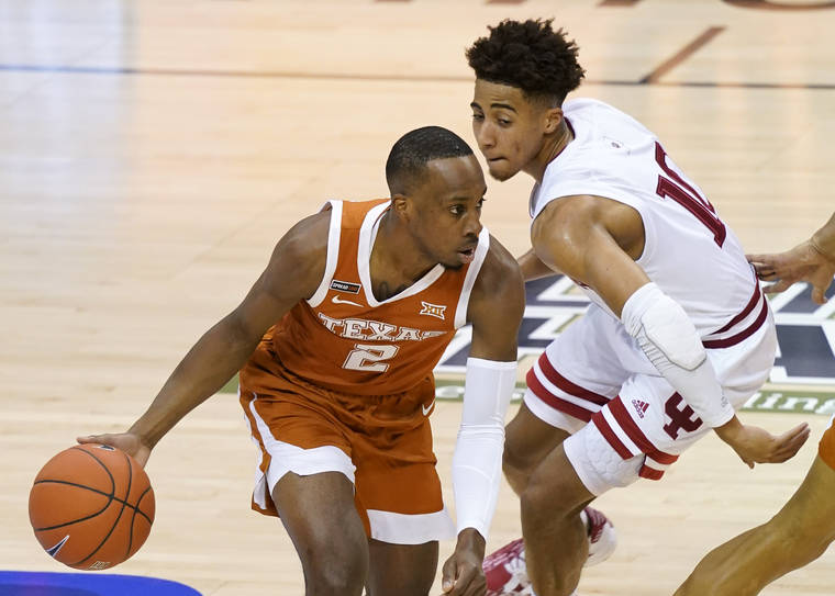 ASSOCIATED PRESS
                                Texas guard Matt Coleman III (2) drives around Indiana guard Rob Phinisee (10) in the first half of a semifinal NCAA college basketball game in the Maui Invitational tournament today in Asheville, N.C.