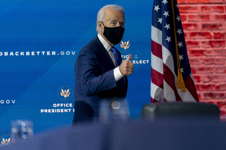 ASSOCIATED PRESS
                                President-elect Joe Biden departs a news conference after introducing his nominees and appointees to economic policy posts at The Queen theater in Wilmington, Del., on Tuesday.