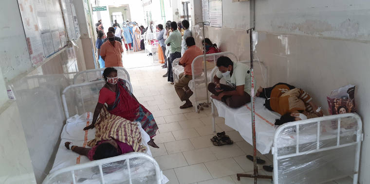 ASSOCIATED PRESS
                                Patients and their bystanders are seen at the district government hospital in Eluru, Andhra Pradesh state, India, on Sunday. Over 200 people have been hospitalized due to an unidentified illness in this ancient city famous for its hand woven products.