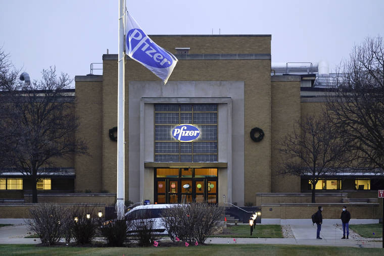 ASSOCIATED PRESS / DEC. 11
                                The Pfizer Global Supply Kalamazoo manufacturing plant is shown in Portage, Mich. The U.S. gave the final go-ahead Friday to the nation’s first COVID-19 vaccine, marking what could be the beginning of the end of an outbreak that has killed nearly 300,000 Americans.