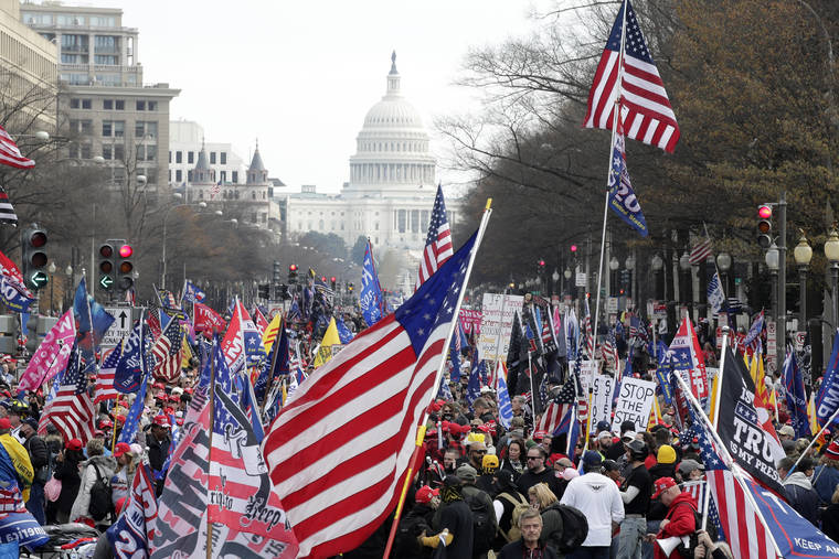 ASSOCIATED PRESS
                                With the U.S. Capitol building in the background, supporters of President Donald Trump stand Pennsylvania Avenue during a rally at Freedom Plaza on Saturday in Washington.