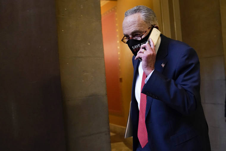 ASSOCIATED PRESS
                                Senate Minority Leader Sen. Chuck Schumer of N.Y., walks on Capitol Hill Tuesday. A breakthrough in Congressional budget talks came late Saturday in the fight over Federal Reserve emergency powers that was resolved by Schumer and conservative Republican Pat Toomey of Pennsylvania.
