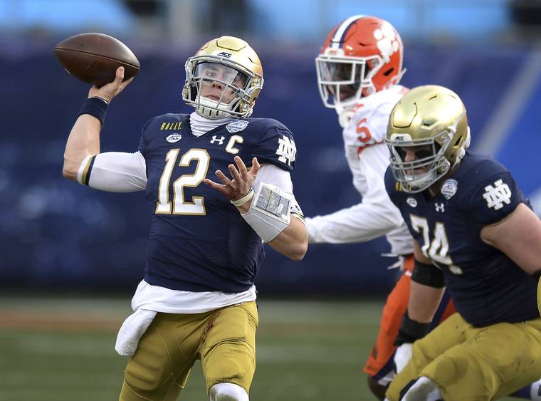 ASSOCIATED PRESS
                                Notre Dame quarterback Ian Book throws a pass against Clemson during the Atlantic Coast Conference championship NCAA college football game on Saturday in Charlotte, N.C.