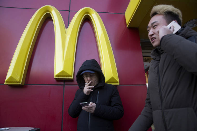 ASSOCIATED PRESS / JAN. 2017
                                A man smoked outside a McDonald’s restaurant in Beijing, China. McDonald’s is selling a sandwich made of Spam topped with crushed Oreo cookies, Monday, in China in an attention-grabbing move that has raised eyebrows.