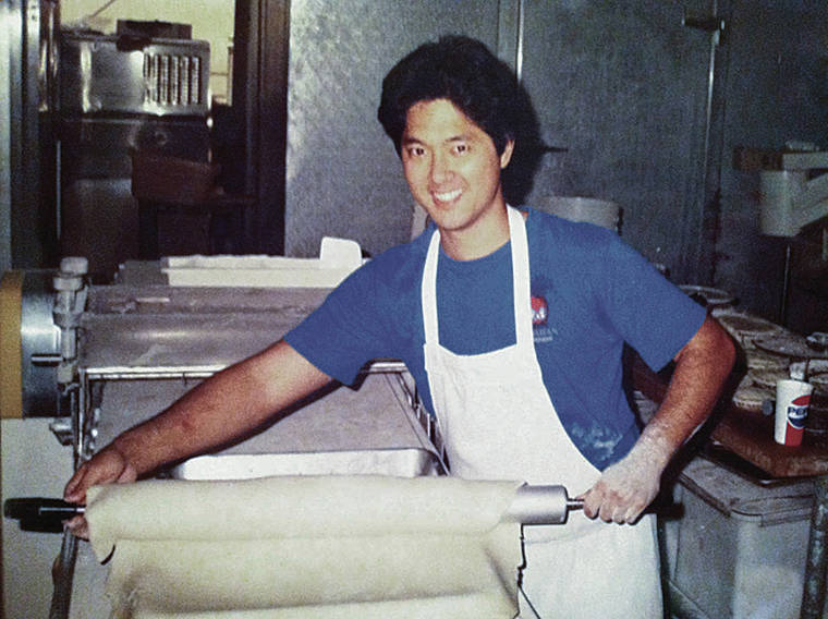 COURTESY TED’S BAKERY
                                Ted Nakamura rolls out dough in 1988.