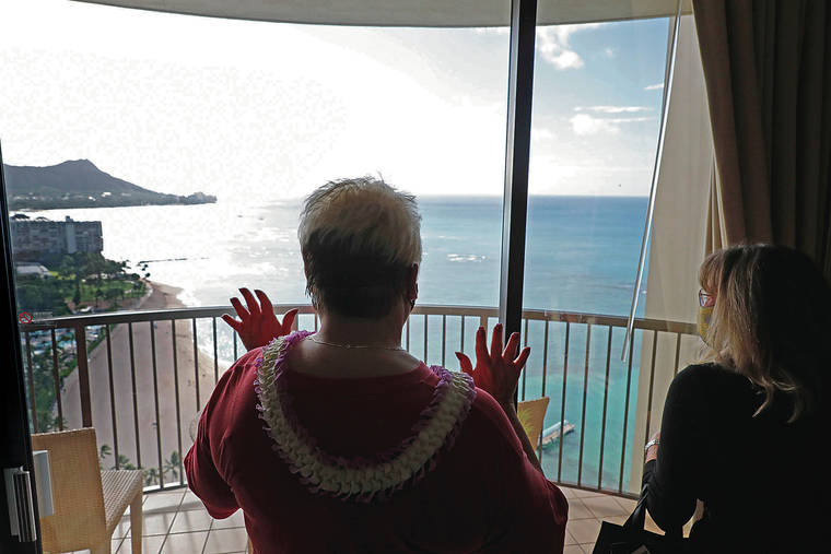 JAMM AQUINO / JAQUINO@STARADVERTISER.COM
                                Joni Blum, left, a visitor from West Virginia, reacted Tuesday to the view in her surprise suite upgrade at Hilton Hawaiian Village in Waikiki. The resort reopened after nearly nine months due to the pandemic.