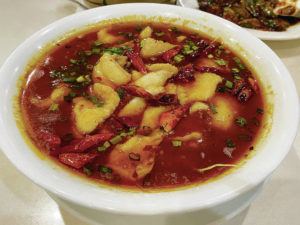 NADINE KAM / SPECIAL TO THE STAR-ADVERTISER
                                Basa fillets are served in a flavorful, spicy sauce at Simply Sichuan. The dish is studded with peppers, but isn’t as fiercely hot as at similar restaurants.