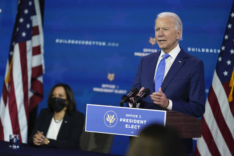 ASSOCIATED PRESS
                                President-elect Joe Biden speaks as Vice President-elect Kamala Harris listens at left, during an event to introduce their nominees and appointees to economic policy posts at The Queen theater in Wilmington, Del.