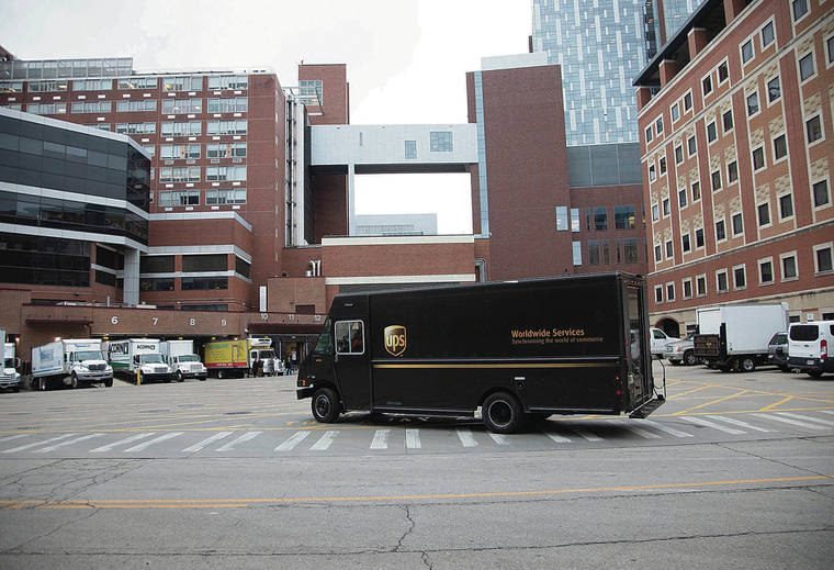 ASSOCIATED PRESS
                                A UPS truck delivered the first vaccines to the Ohio State University Wexner Medical Center.