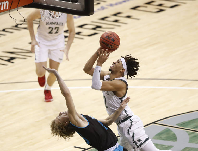 CINDY ELLEN RUSSELL / CRUSSELL@STARADVERTISER.COM
                                Hawaii’s Justin Webster (2) made a plus one over HPU’s Elijah Martinez (1) during the second half of Friday’s game at the SimpliFi Arena at Stan Sheriff Center. The Bows defeated the Sharks, 83-50.