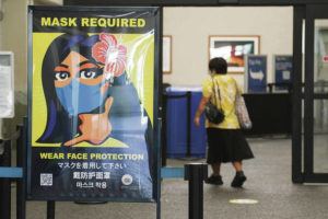 ASSOCIATED PRESS
                                A woman walks into the international airport in Honolulu.