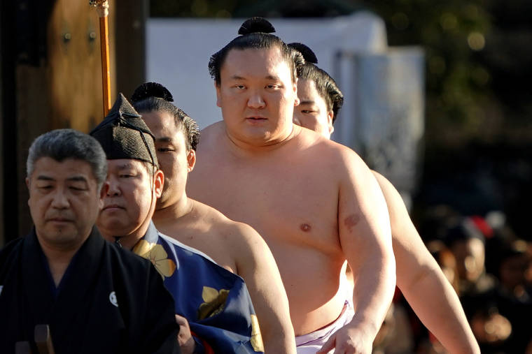ASSOCIATED PRESS / 2018
                                Sumo grand champion Hakuho, second from right, of Mongolia arrives to perform his ring entry form at the Meiji Shrine in Tokyo.