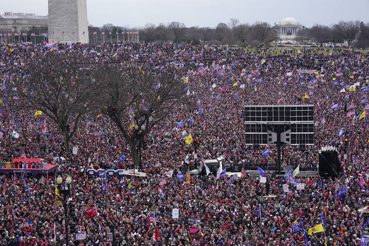 ASSOCIATED PRESS
                                With the Washington Monument in the background, people attended a rally in support of President Donald Trump near the White House, today, in Washington.