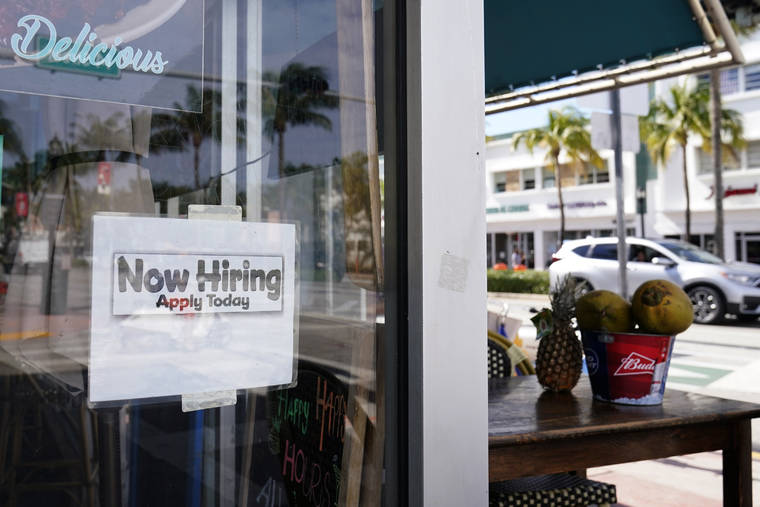 ASSOCIATED PRESS
                                A “Now Hiring,” sign is shown in the window of a restaurant in Miami Beach, Fla.