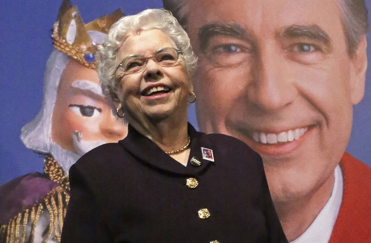 ASSOCIATED PRESS / 2018
                                Joanne Rogers stands in front of a giant Mister Rogers Forever Stamp following the first-day-of-issue dedication in Pittsburgh.