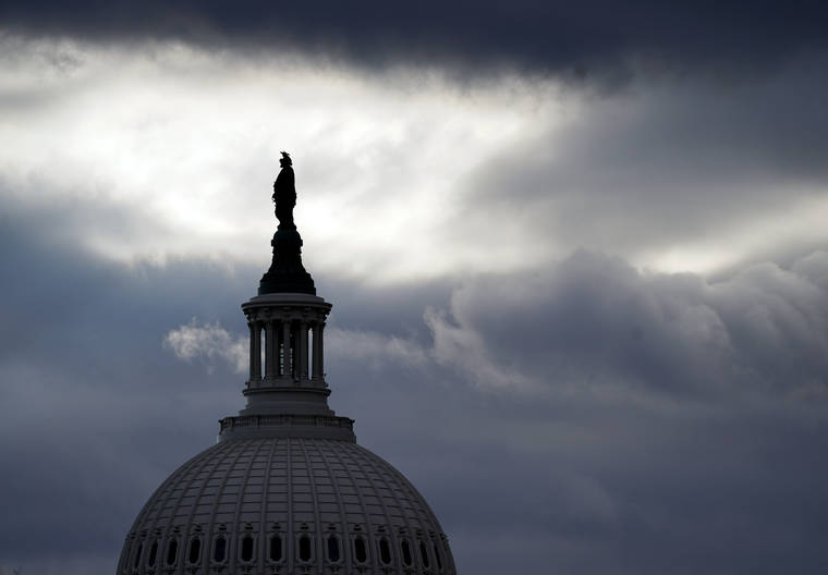 ASSOCIATED PRESS
                                The bronze Statue of Freedom, by Thomas Crawford, is the crowning feature of the dome of the U.S. Capitol, shown ahead of the inauguration of President-elect Joe Biden and Vice President-elect Kamala Harris today in Washington.