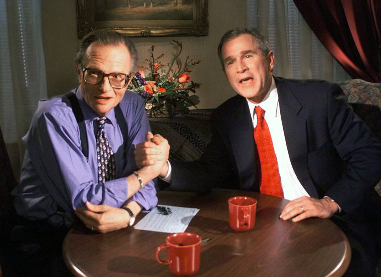 ASSOCIATED PRESS / 1999
                                Republican presidential candidate Texas Gov. George W. Bush jokes with CNN’s Larry King after finishing the “Larry King Live” show from the Wildhorse Saloon in Nashville, Tenn. King, who interviewed presidents, movie stars and ordinary Joes during a half-century in broadcasting, has died at age 87.