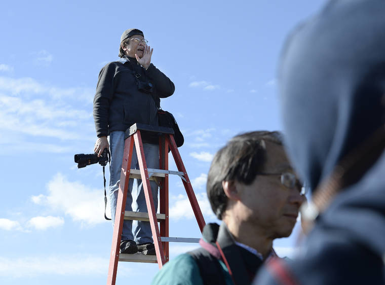 SCOTT SOMMERDORF/THE SALT LAKE TRIBUNE VIA ASSOCIATED PRESS
                                Photographer Corky Lee shouted to the Chinese community posing near the Golden Spike re-enactment ceremony, in May 2014, in Promontory, Utah, as he made a photo of them to honor Chinese immigrants who built the railroad from the west. Lee, a photojournalist who spent five decades spotlighting the often ignored Asian and Pacific Islander American communities, died Wednesday, in Queens, New York of complications due to COVID-19. He was 73.