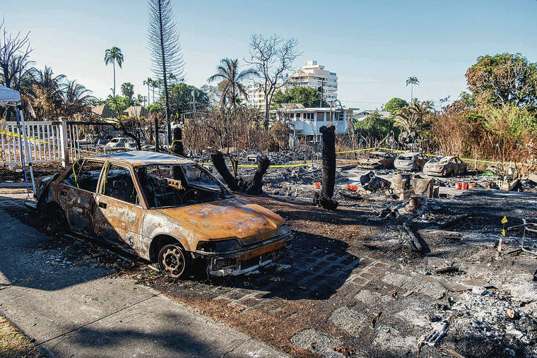 JAMM AQUINO/JAQUINO@STARADVERTISER.COM
                                A burned vehicle and rubble were all that was left four days after the tragedy.