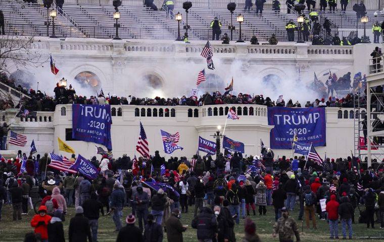 ASSOCIATED PRESS
                                Violent protesters, loyal to President Donald Trump, storm the U.S. Capitol, Wednesday, in Washington.