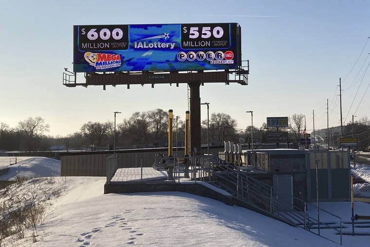 ASSOCIATED PRESS
                                A digital billboard in Des Moines, Iowa, on Monday, shows jackpots for the Mega Millions and Powerball games.