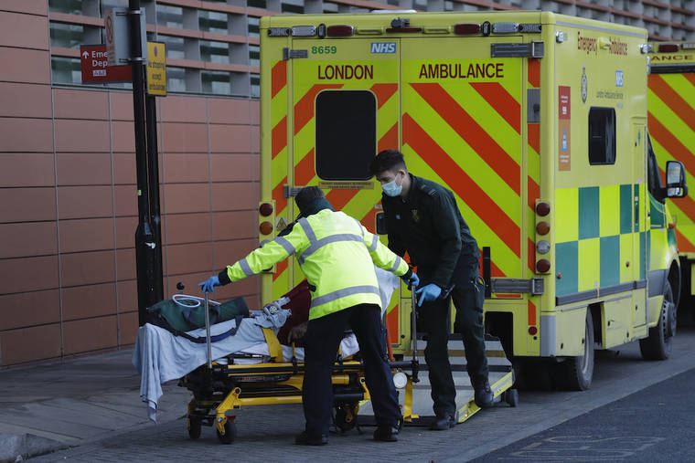 ASSOCIATED PRESS / JAN. 25
                                A patient is pushed on a trolley from an ambulance outside the Royal London Hospital in east London, during England’s third national lockdown since the coronavirus outbreak began. The U.K. is under an indefinite national lockdown to curb the spread of the new variant, with nonessential shops, gyms and hairdressers closed, most people working from home and schools largely offering remote learning.
