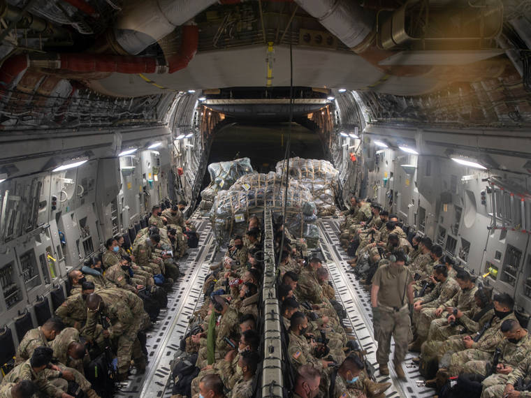 COURTESY SENIOR AIRMAN JOHN LINZMEIER/U.S. AIR NATIONAL GUARD / JAN. 15
                                A C-17 Globemaster III assigned to the 204th Airlift Squadron is fully loaded with Hawaii Army National Guard Soldiers and their gear at Joint Base Pearl Harbor-Hickam.