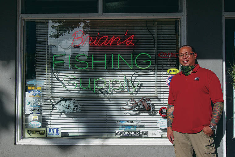 CINDY ELLEN RUSSELL / CRUSSELL@STARADVERTISER.COM
                                Noncommercial fishing has increased during the pandemic, keeping fishing supply stores busy. Brent Young owns Brian’s Fishing Supply on South King Street.