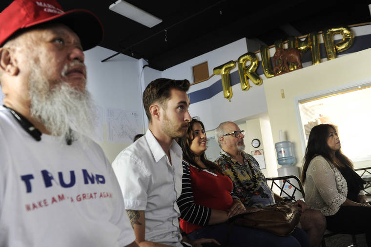 STAR-ADVERTISER / 2016
                                Nick Ochs, second from left, watched the presidential debate between Donald Trump and Hillary Clinton at the Hawaii Republican Party headquarters on Sept. 26, 2016.
