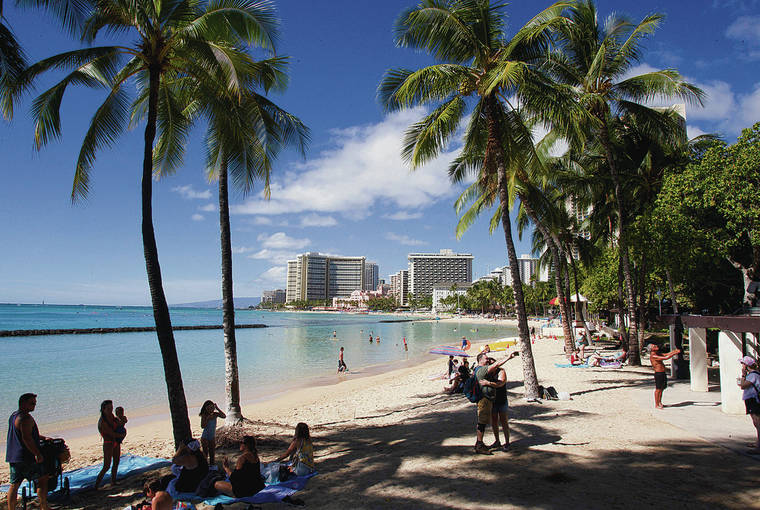 CINDY ELLEN RUSSELL / CRUSSELL@STARADVERTISER.COM
                                The lieutenant governor is asking for Hawaii residents to avoid gatherings for two weeks. Beach activity was light Thursday in Waikiki.