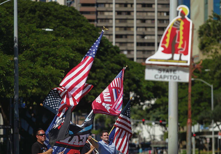 CINDY ELLEN RUSSELL / CRUSSELL@STARADVERTISER.COM
                                Hawaii supporters of President Donald Trump gathered Wednesday at the state Capitol as a mob of Trump supporters stormed the U.S. Capitol.